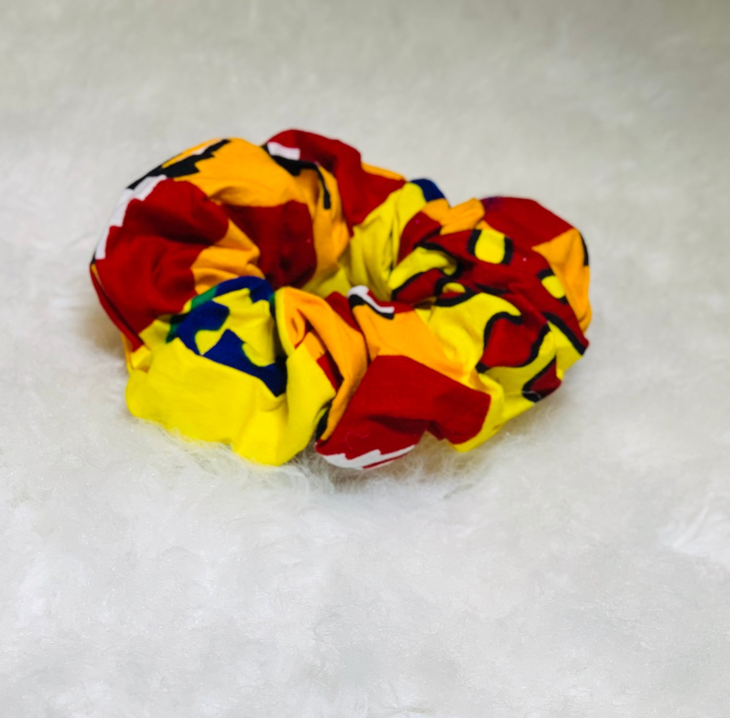One Large Yellow, Red, Cream , Black And Blue Scrunchie
