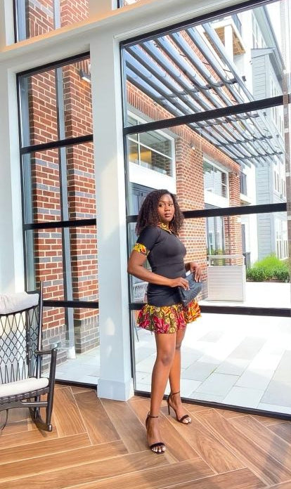 Solid Black Color With A Spread Short Sleeve Mid Dress. Spread Collar, Sleeve Edge And Dress Edges Made Of Yellow, Black And Wine Pattern Ankara Wax Print