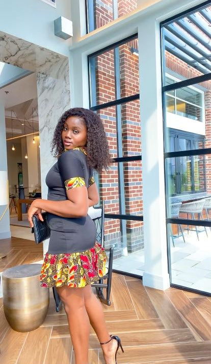 Solid Black Color With A Spread Short Sleeve Mid Dress. Spread Collar, Sleeve Edge And Dress Edges Made Of Yellow, Black And Wine Pattern Ankara Wax Print