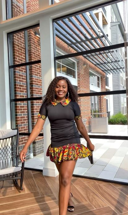 Solid Black Color With A Spread Short Sleeve Mid Dress. Spread Collar, Sleeve Edge And Dress Edges Made Of Yellow, Black And Wine Pattern Ankara Wax Print