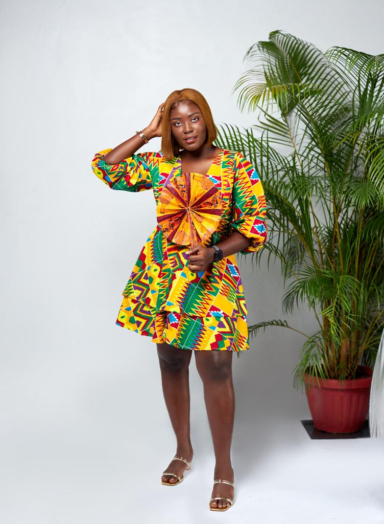 A Blend Of Yellow, Red, Purple, Blue And Green Kente Print V Neck Mid Puff Sleeve double Layered Midi Dress