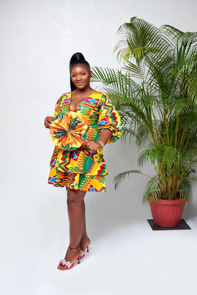 A Blend Of Yellow, Red, Purple, Blue And Green Kente Print V Neck Mid Puff Sleeve double Layered Midi Dress