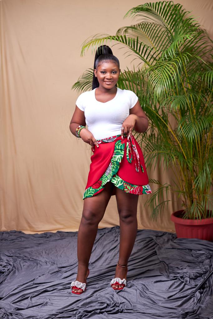 Sexy red wrap mini skirt made from a combination of red scuba and a green,red,white ankara fabric.