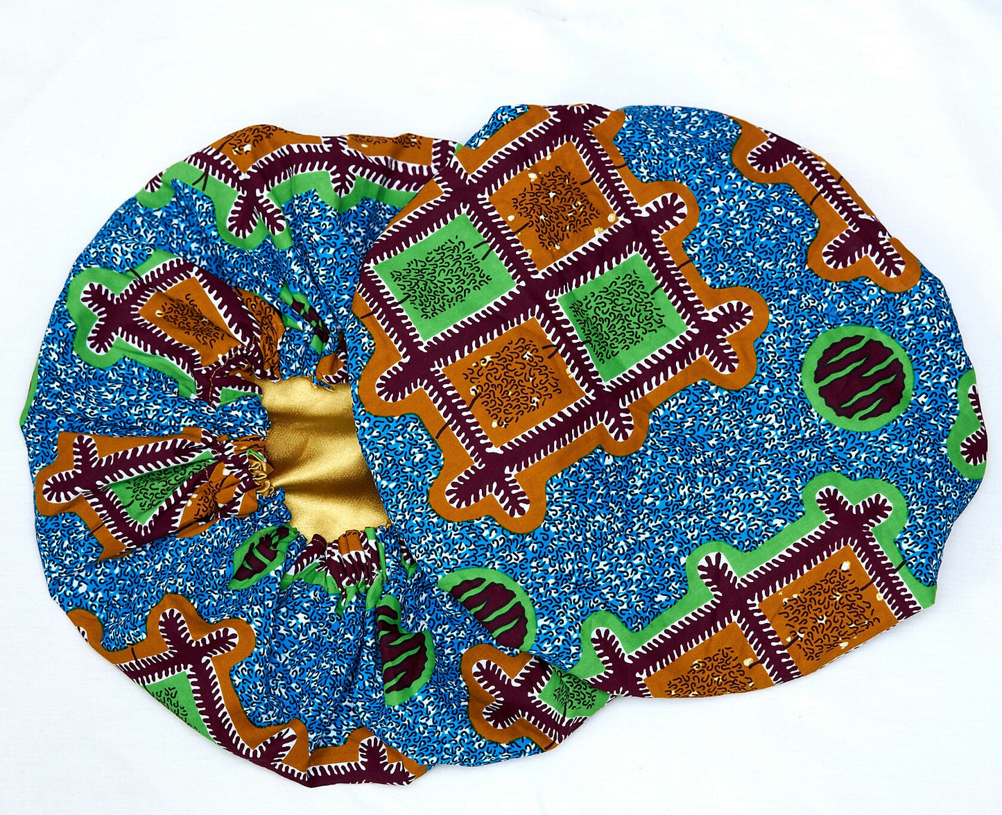 An Ankara Wax Print Made of Seablue, Green, Brown and White Blended Beautiful Colours And Pattern, Hand Made Elastic Silklined Bonnet With Band