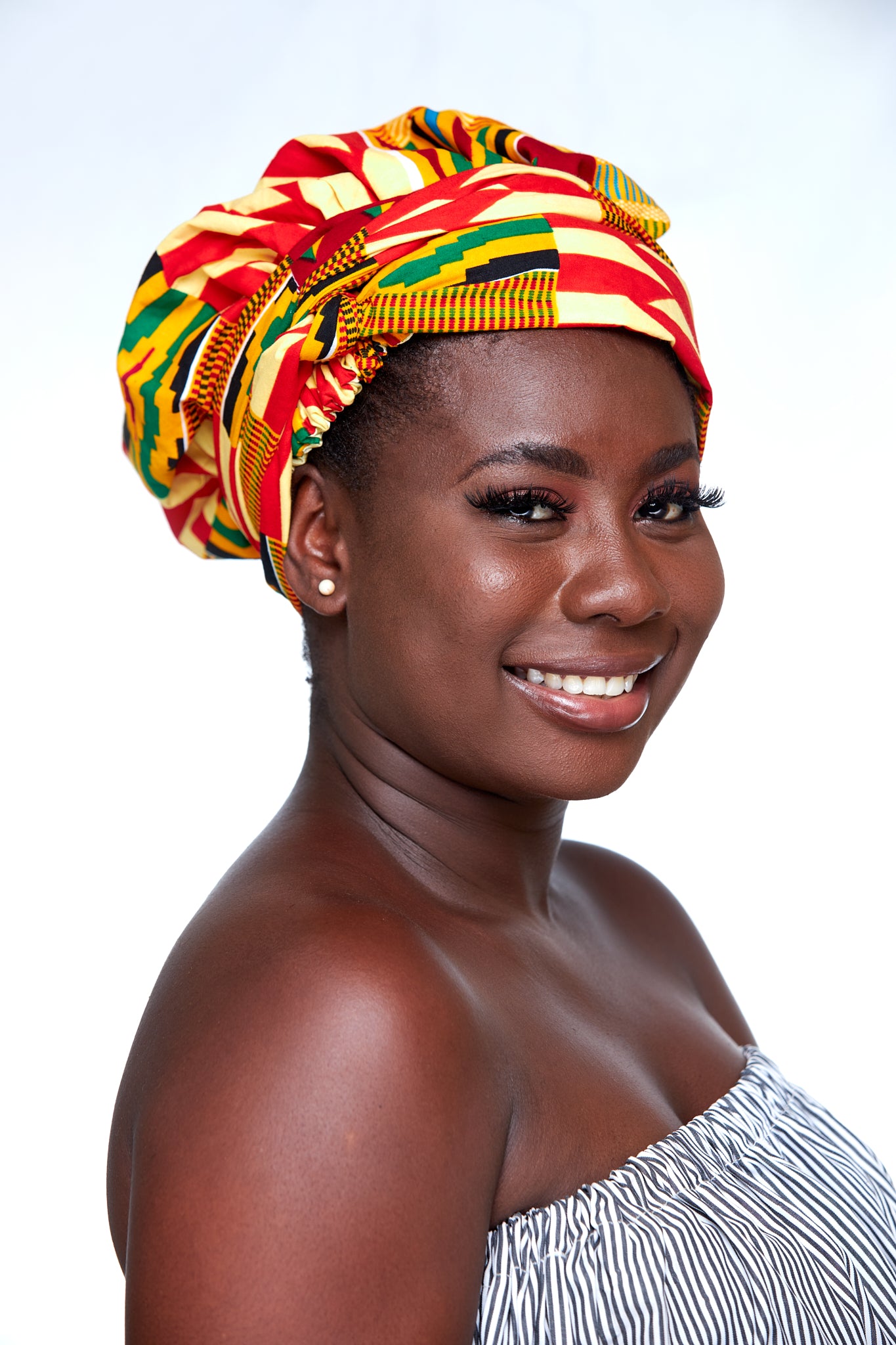 Ghanaian Kente Print Made of Pink, yellow, Black and Gold Blended Beautiful Colours, Hand Made Elastic Silklined Bonnet With Band