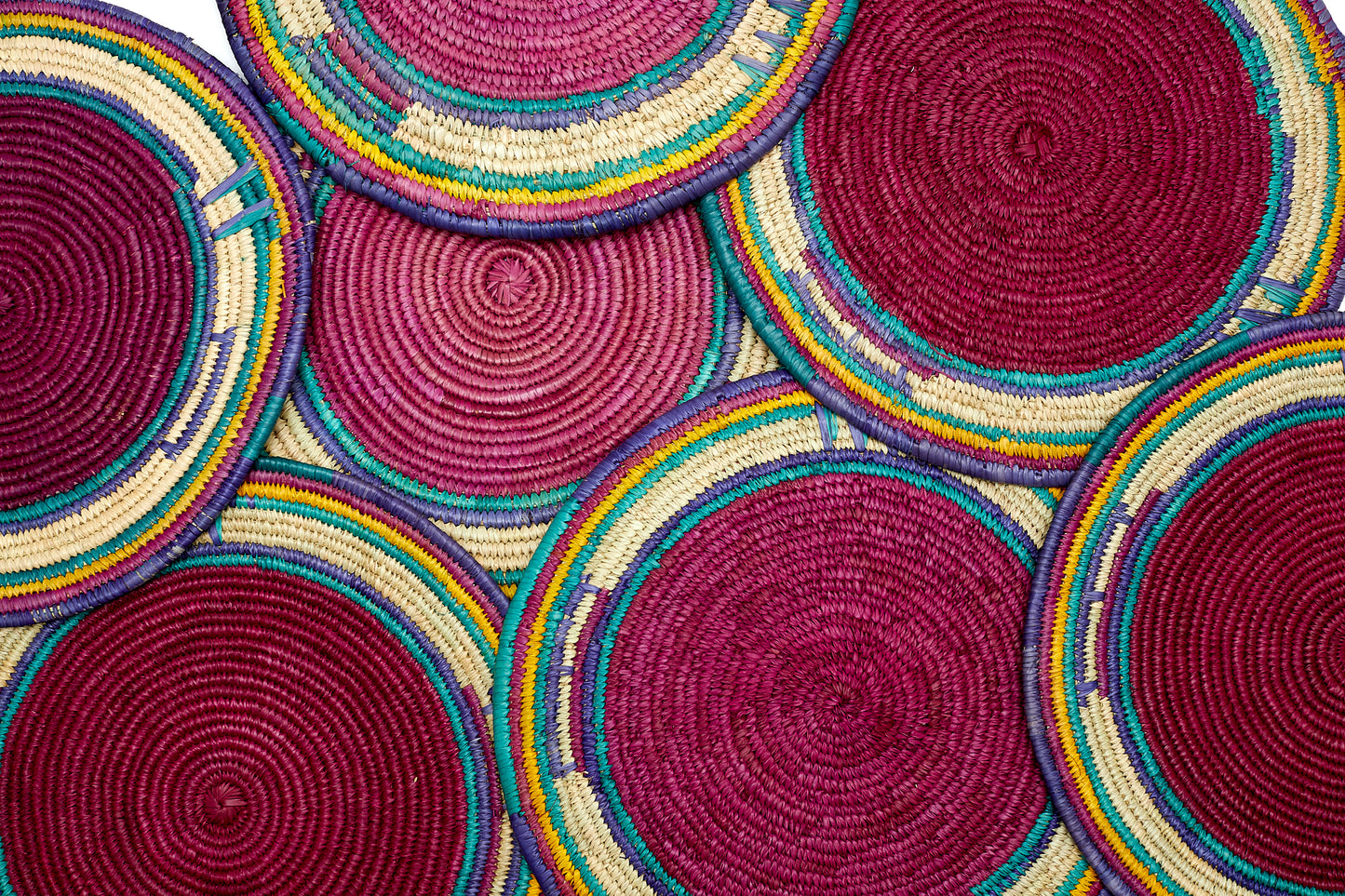 Pink,blue,green, yellow and cream colored round African hand woven multipurpose Trivet, Woven Wall Disc, Wall Plate, Hanging Basket, Wall Decor