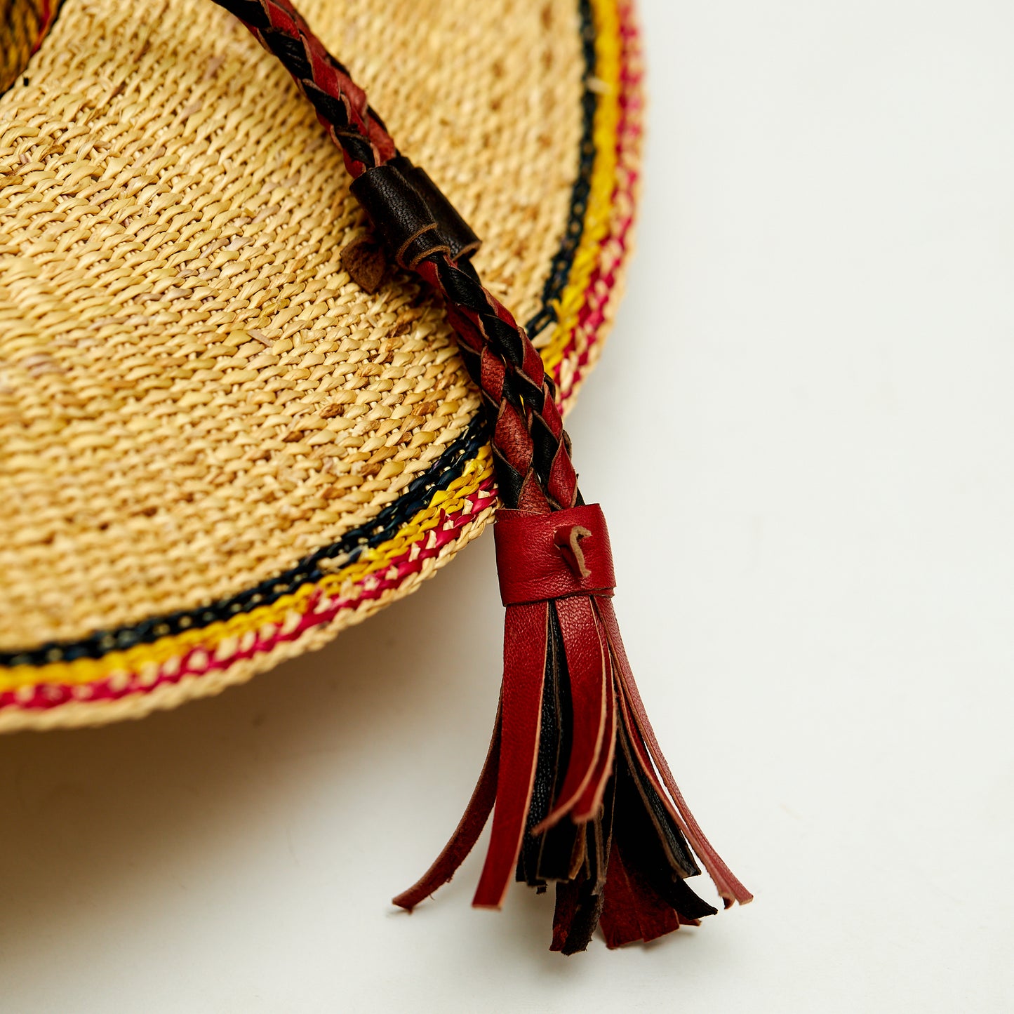 Natural Elephant Grass Handwoven Garden Hat Designed with Black, yellow and red colors,Made in the Northern part of Ghana-Bolgatanga.