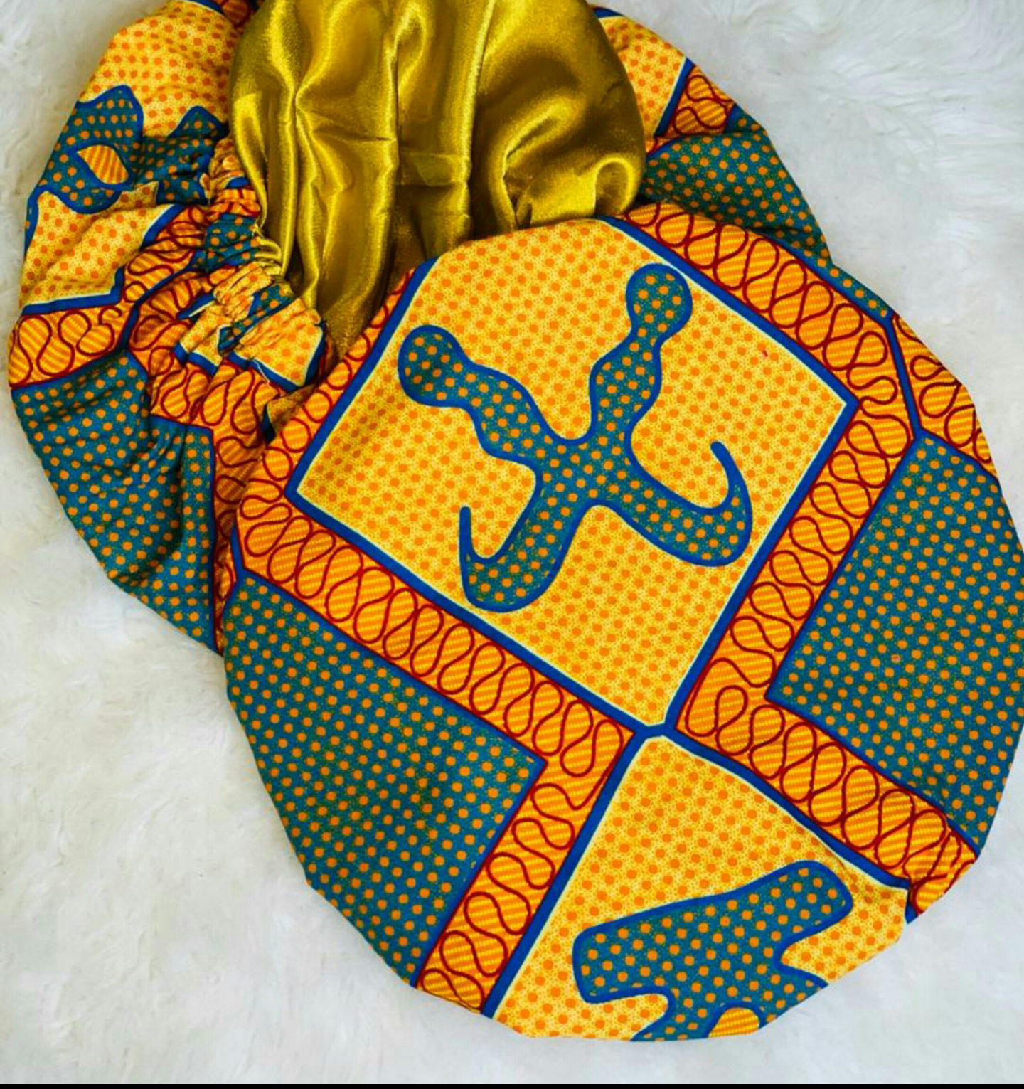 Red, Blue And Yellow Akofena Symbol pattern Ankara Wax Print With Gold Silk Lined Hair Bonnet