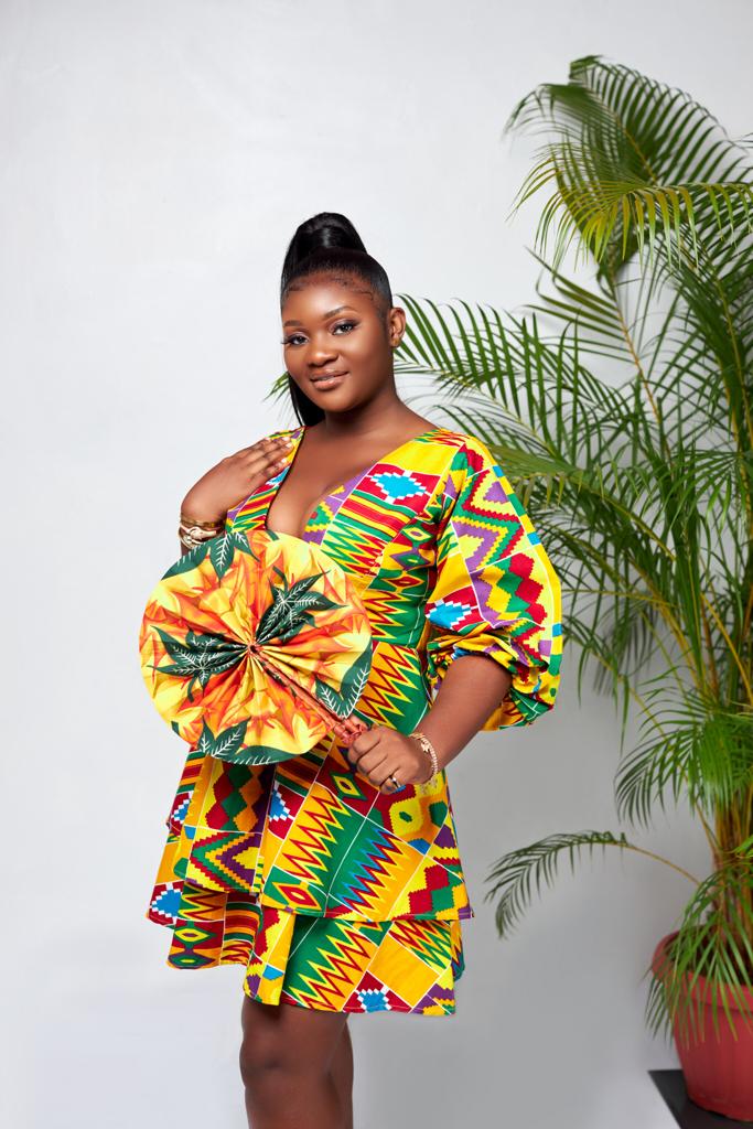 A Blend Of Yellow, Red, Purple, Blue And Green Kente Print V Neck Mid Puff Sleeve double Layered Midi Dress
