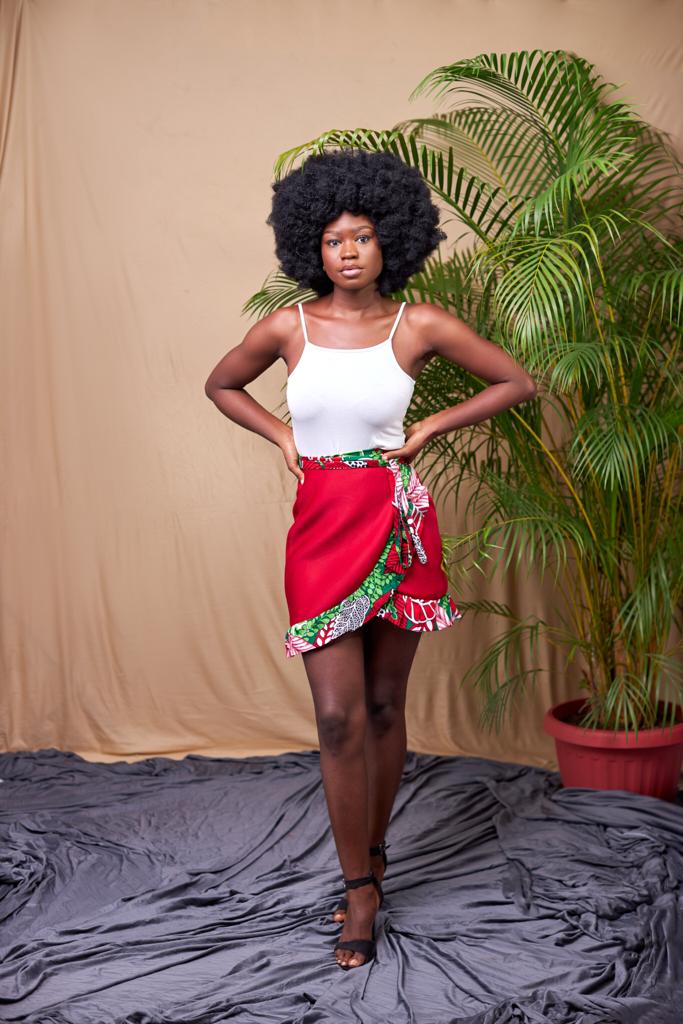 Sexy red wrap mini skirt made from a combination of red scuba and a green,red,white ankara fabric.