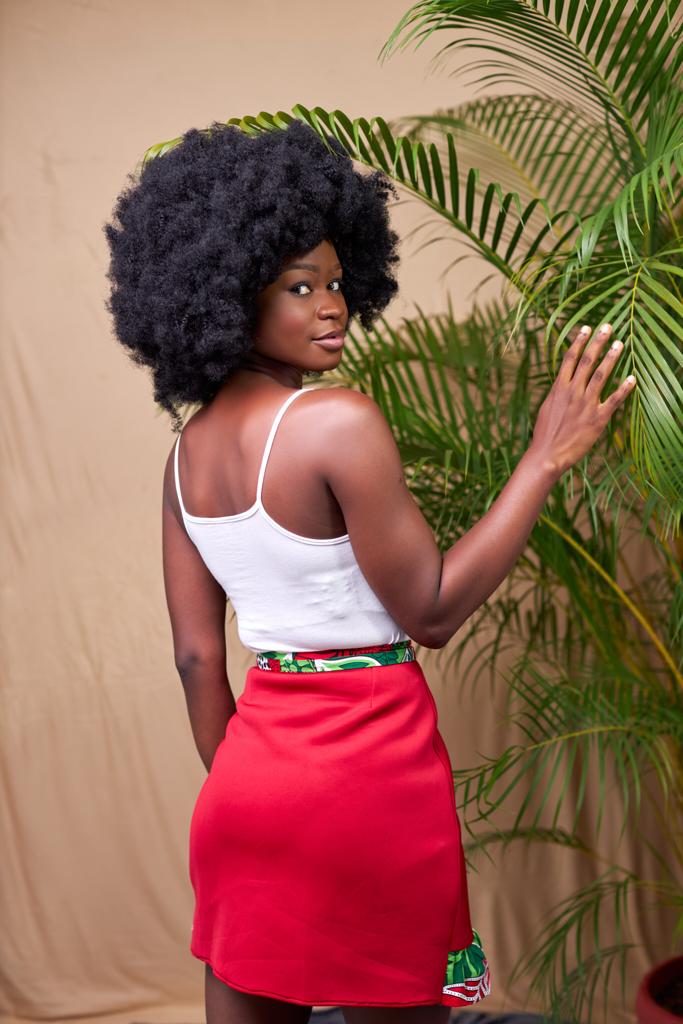 Sexy red wrap mini skirt made from a combination of red scuba and a green,red,white ankara fabric.