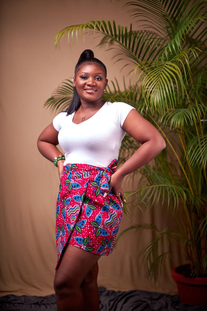 Sexy pink wrap mini skirt made from a pink,green,seablue and white butterfly designed ankara fabric.