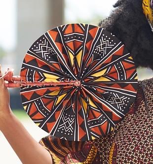 Curry-brown, yellow, black and white dotted printed bogolan foldable handfan