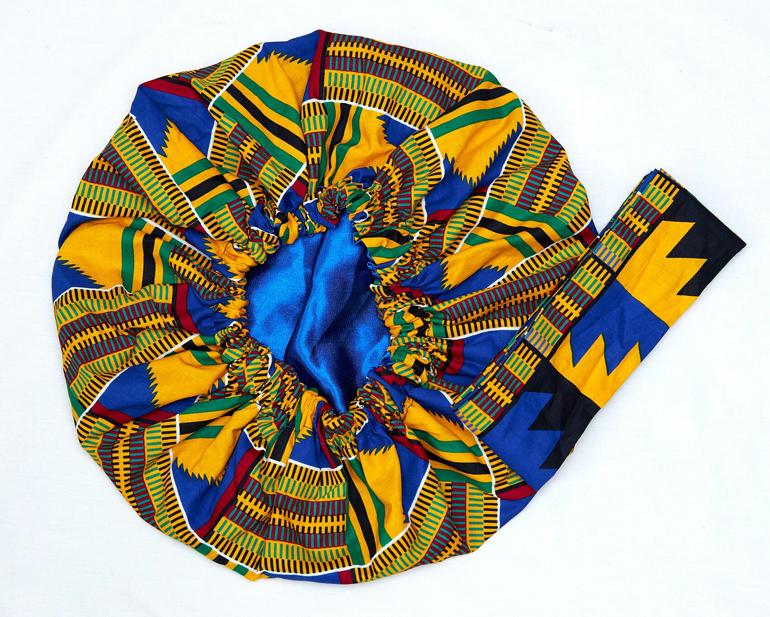 A Ghanaian Kente Wax Print Made of Blue, Green, Red ,Black and White Blended Beautiful Colours And Pattern, Hand Made Elastic Silklined Bonnet With Band