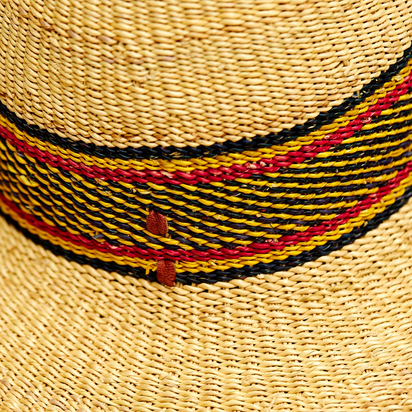 Natural Elephant Grass Handwoven Garden Hat Designed with Black, yellow and red colors,Made in the Northern part of Ghana-Bolgatanga.-Bolgatanga.