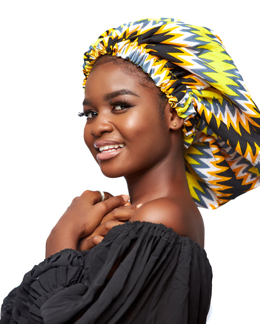 Ghanaian Kente Wax Print Made of Yellow, Gold,,Ash White and Black Blend of Beautiful Colours And Pattern With Adinkira Symbols, Hand Made Elastic With Gold Silk lined Hair Bonnet